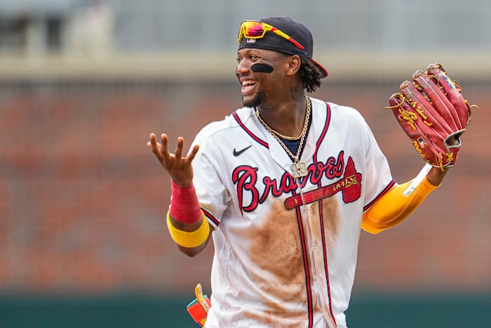 Jul 2, 2023; Cumberland, Georgia, USA; Atlanta Braves right fielder Ronald Acuna Jr. (13) reacts after the Braves defeated the Miami Marlins at Truist Park.